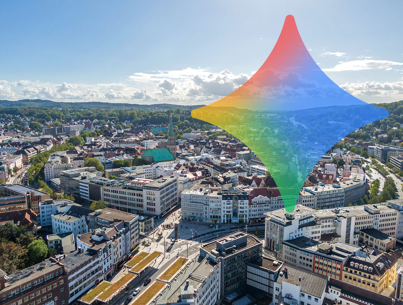 Luftaufnahme von Bielefeld mit Innenstadt und Kirche, darüber ein großes, transparentes Google Gemini Symbol als Visual für KI und Generative Engine Optimization